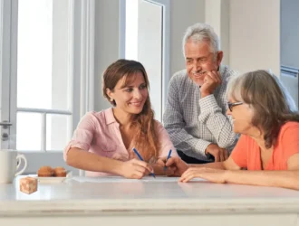 Seniors playing brain teasers puzzles with young girl