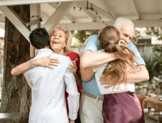 Children hugging their grandma, showing love and family bond