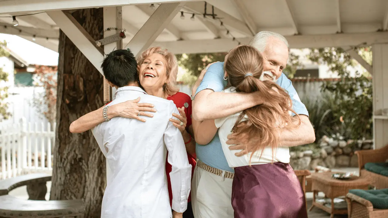 Children hugging their grandma, showing love and family bond