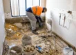 Construction worker renovating a bathroom for seniors, preparing for bathroom upgrades to improve accessibility