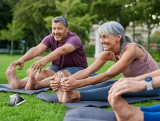 Seniors performing chair exercises for belly fat, targeting core strength and abdominal muscles, to reduce belly fat and improve posture