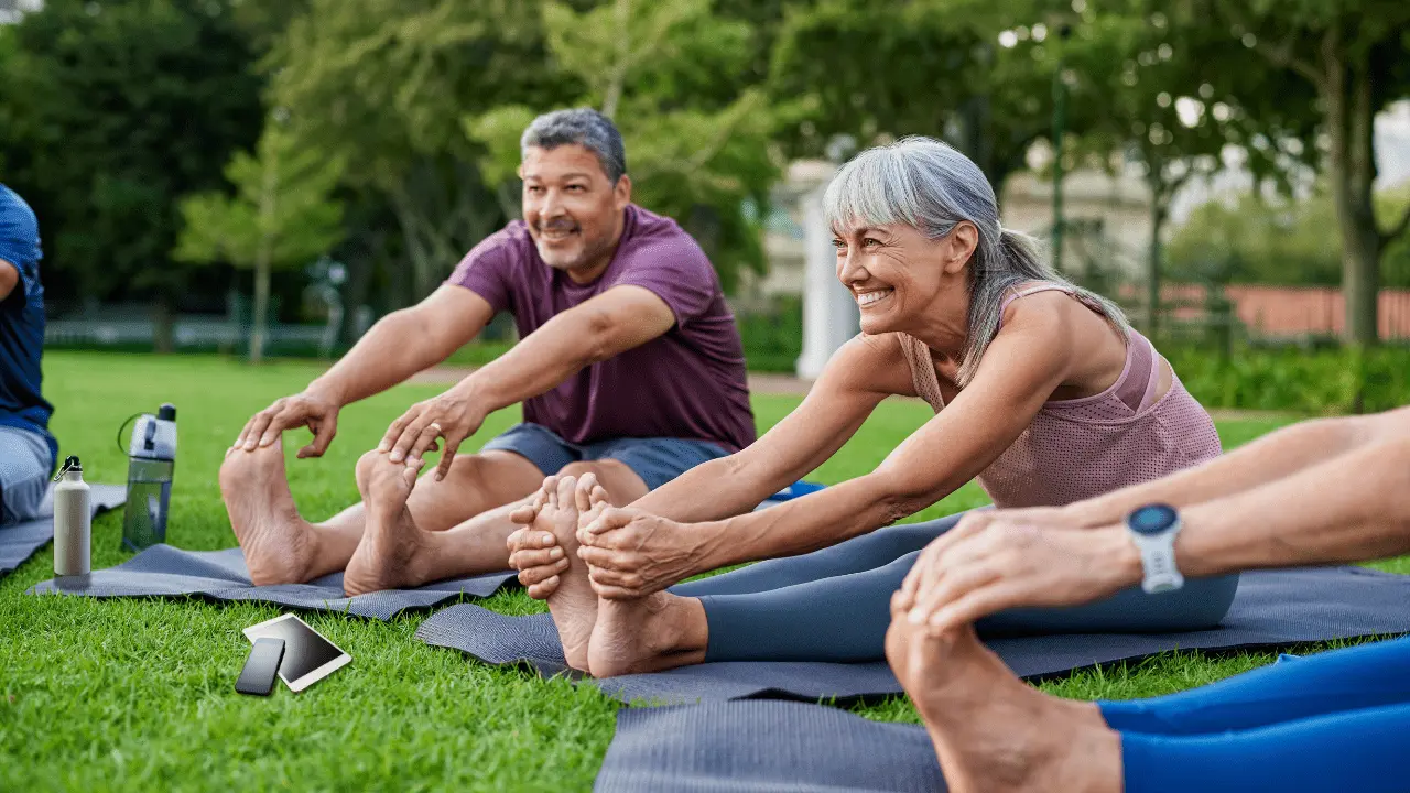 Seniors performing chair exercises for belly fat, targeting core strength and abdominal muscles, to reduce belly fat and improve posture