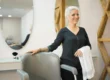 A 50-year-old woman getting a short, trendy haircut in a salon — a stylish hairstyle idea for older women