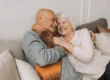 Older couple smiling together, sharing a warm and affectionate moment, highlighting the joy of aging and the importance of dental health