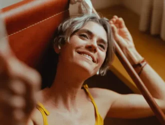 Senior woman smiling and feeling comfortable, showcasing a relaxed, confident expression, ideal for seniors seeking the best support bras for comfort and style.